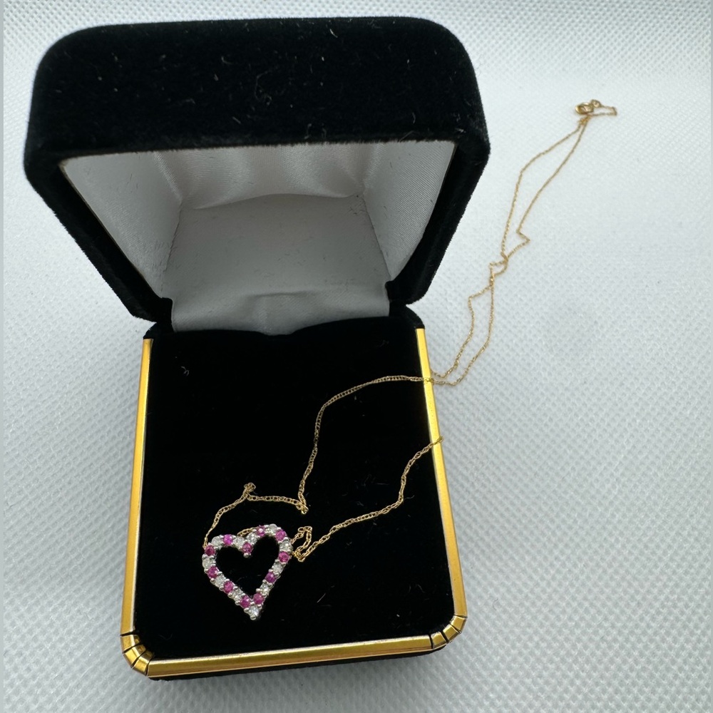 10 K stamped heart, pendant and chain, genuine, diamonds, and stone